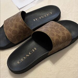 Coach ladies slides. Signature brown and black design, Wworn once.size 11